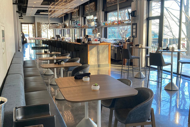 Hotel Indigo restaurant bar seating area with dimmable LED pendant light fixtures