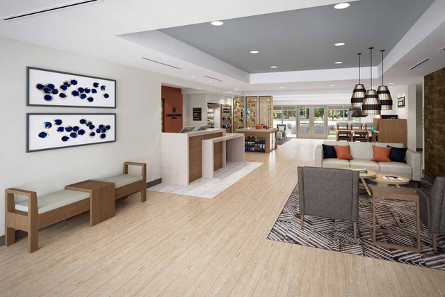 Candlewood Suites lobby entryway showcasing decorative LED pendant and ambient lighting