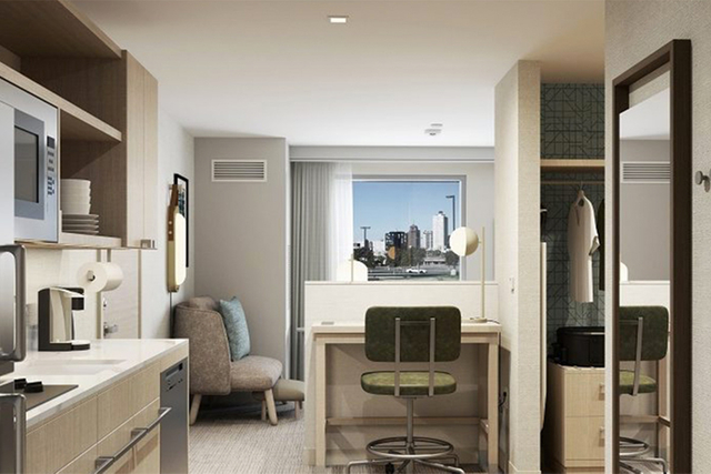 Homewood Suites king suite bedroom with brand approved bedside lamps 2700K warm white