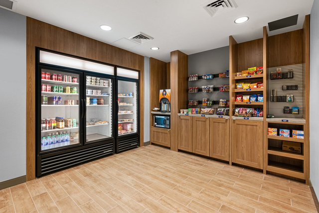 Hotel convenience store cupboard area with bright LED display and merchandise lighting