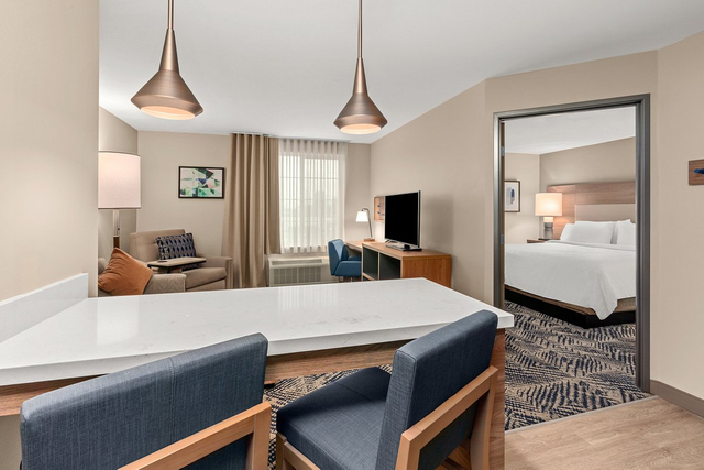 One bedroom suite with LED pendant lights over dining area and separate living space