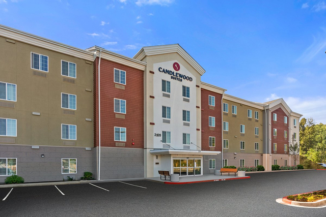 Candlewood Suites hotel exterior showcasing LED parking lot and building facade lights