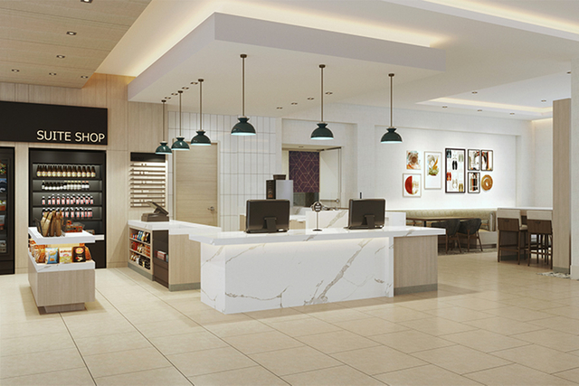 Homewood Suites lobby entry with Hilton approved black pendant lights and floor lamps
