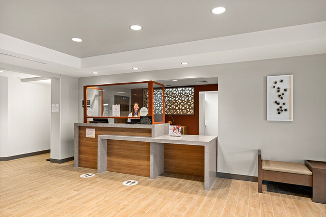 Candlewood Suites 24 hour front desk with commercial LED lighting and welcoming ambiance
